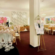 Festive reception area with champagne glasses and decorated tables at La Mami Acasa